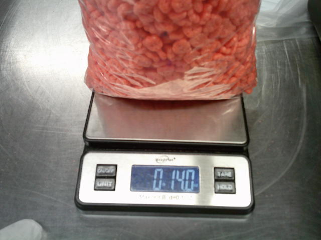 Bag of franken berries on a weight that read as 14 ounces.